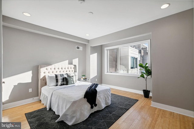 bedroom with light hardwood / wood-style floors