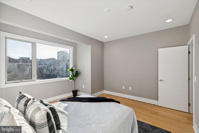 bedroom with wood-type flooring