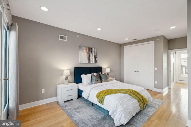 bedroom featuring hardwood / wood-style flooring and a closet