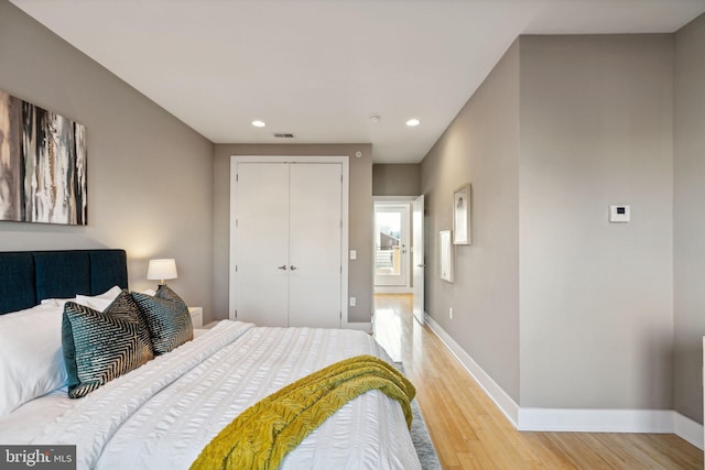 bedroom with a closet and wood-type flooring