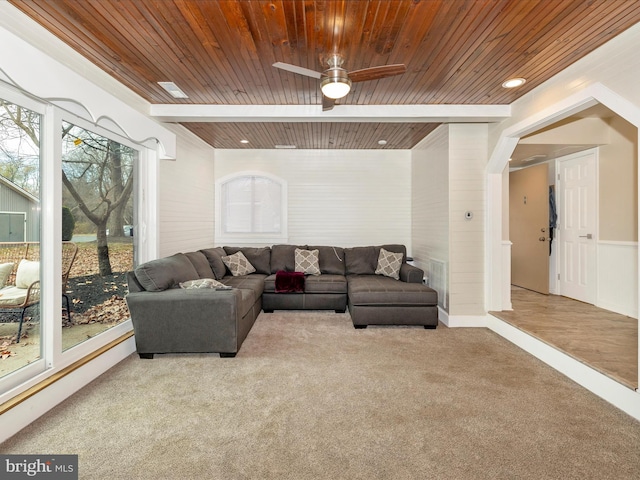 living room featuring light colored carpet, ceiling fan, and wood ceiling