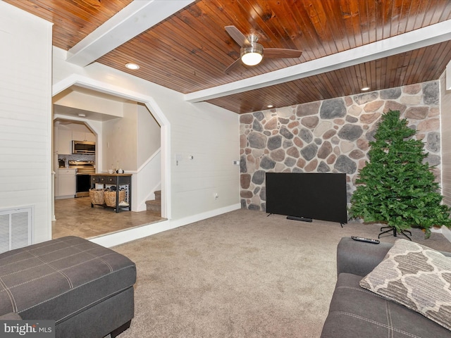 living room with beamed ceiling, ceiling fan, wooden ceiling, and carpet