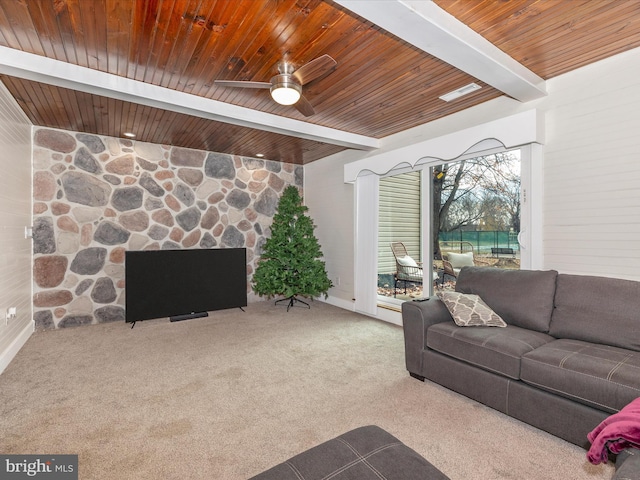 carpeted living room featuring beam ceiling, ceiling fan, and wood ceiling