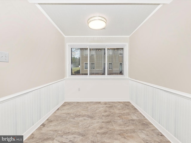 spare room featuring ornamental molding