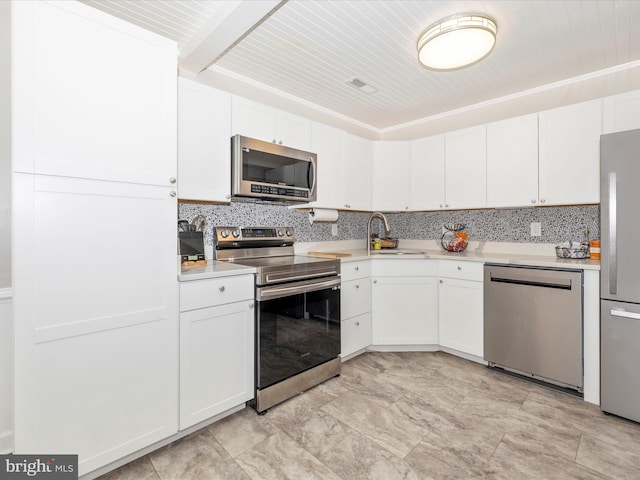 kitchen with white cabinets, stainless steel appliances, and sink