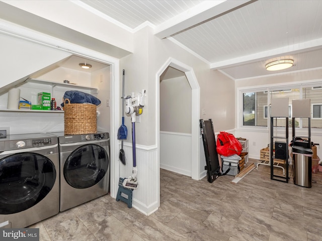 laundry area with wood ceiling, crown molding, and washing machine and clothes dryer