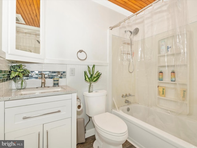 full bathroom featuring tasteful backsplash, toilet, shower / tub combo with curtain, vanity, and ornamental molding