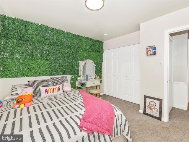 carpeted bedroom featuring a closet