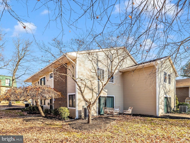 view of home's exterior featuring central AC unit and a garage