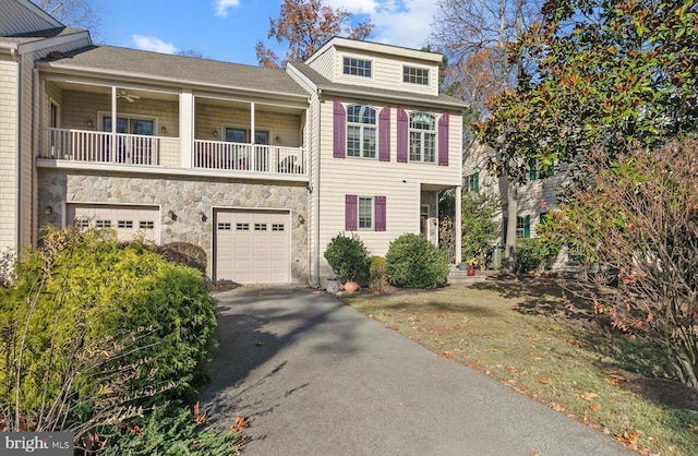 view of front of property with a balcony and a garage