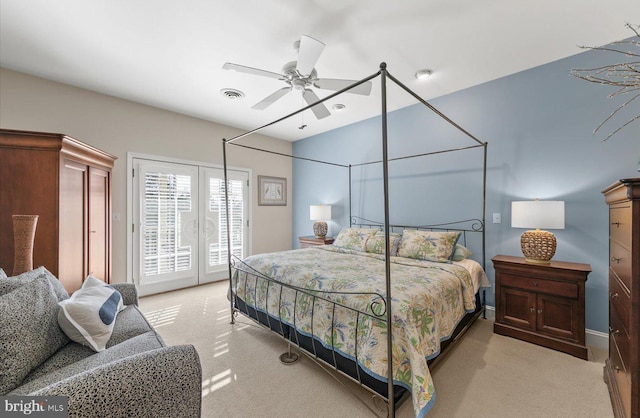 bedroom with access to outside, ceiling fan, and light colored carpet