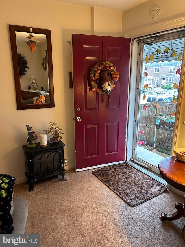 foyer featuring carpet