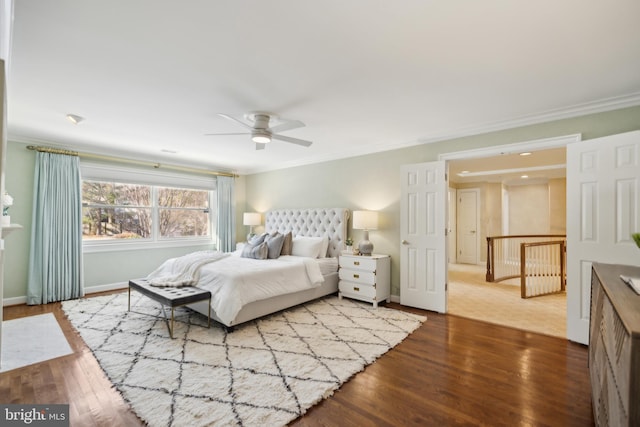 bedroom with ceiling fan, crown molding, and wood-type flooring