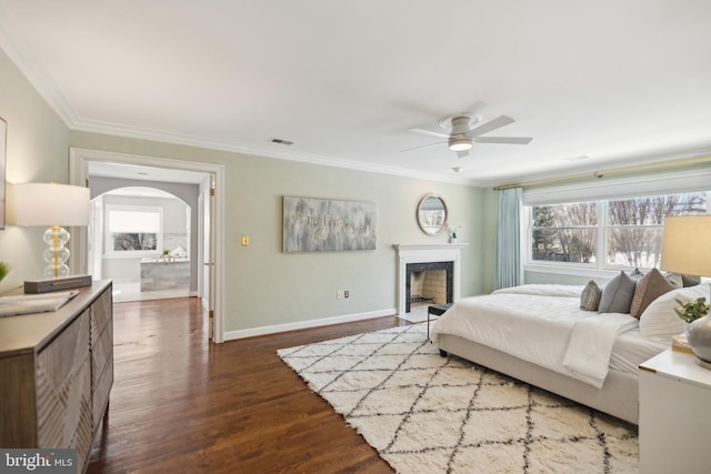 bedroom with ceiling fan, crown molding, and hardwood / wood-style floors