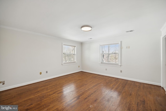 unfurnished room featuring dark hardwood / wood-style floors and crown molding