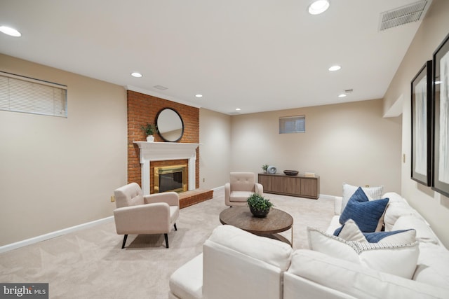 carpeted living room featuring a brick fireplace