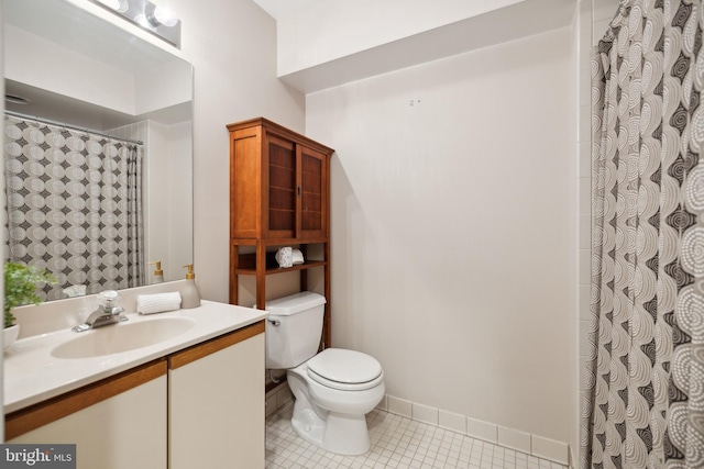 bathroom featuring toilet, walk in shower, and vanity