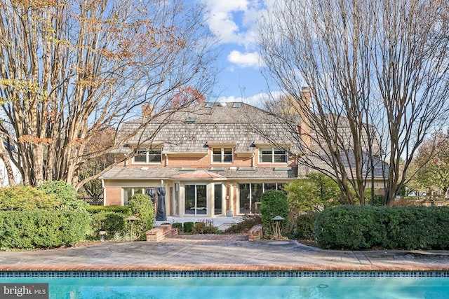 rear view of house featuring a patio