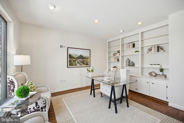 office with dark hardwood / wood-style floors