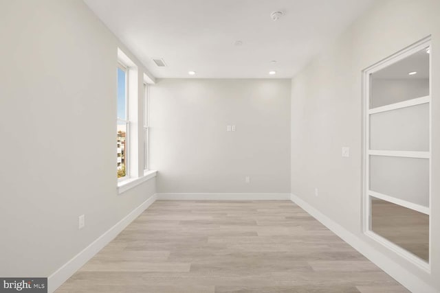 unfurnished room featuring light hardwood / wood-style floors