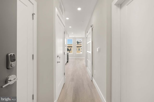 corridor featuring light hardwood / wood-style floors