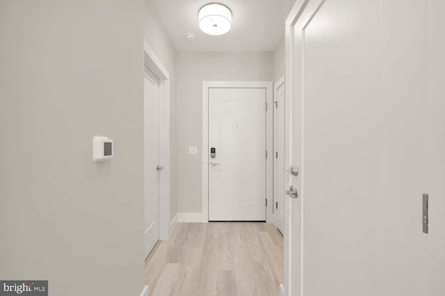 corridor featuring light hardwood / wood-style flooring