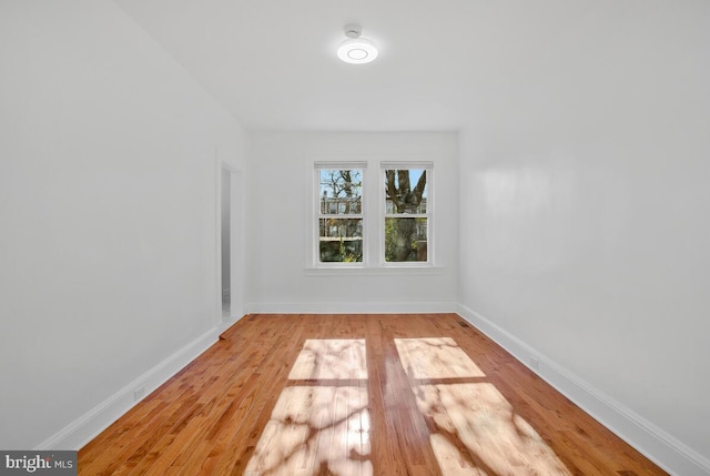 3917 Ridgewood Ave, Baltimore, MD 21215 - unfurnished room with light wood-style floors, baseboards, and a smoke detector