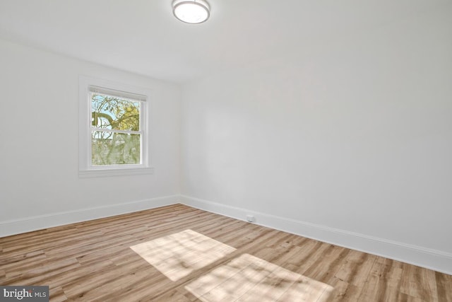 unfurnished room with light wood-type flooring