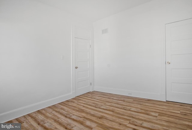 unfurnished room with light hardwood / wood-style flooring