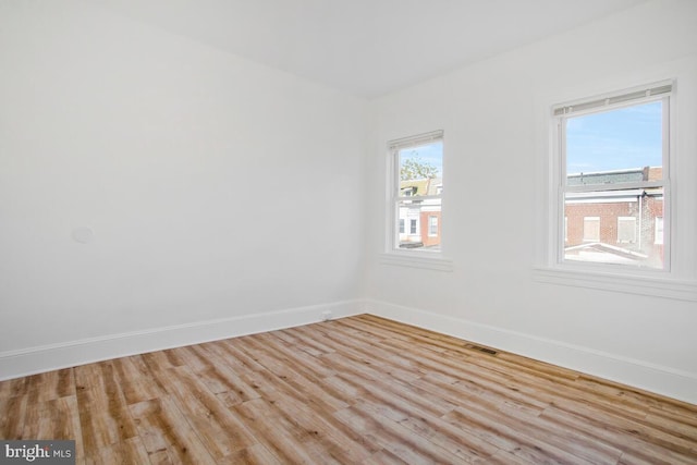 unfurnished room featuring light wood-type flooring