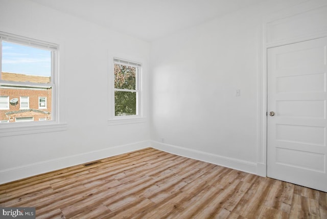 spare room featuring light hardwood / wood-style floors