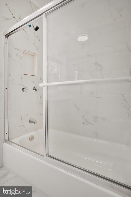 3917 Ridgewood Ave, Baltimore, MD 21215 - full bath with enclosed tub / shower combo and marble look tile flooring