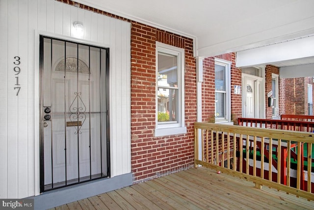 3917 Ridgewood Ave, Baltimore, MD 21215 - view of exterior entry with brick siding and a porch