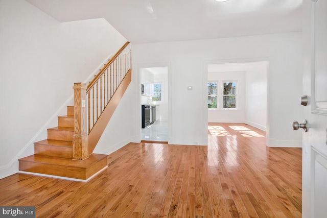 3917 Ridgewood Ave, Baltimore, MD 21215 - entrance foyer with light wood-style flooring, stairway, and baseboards