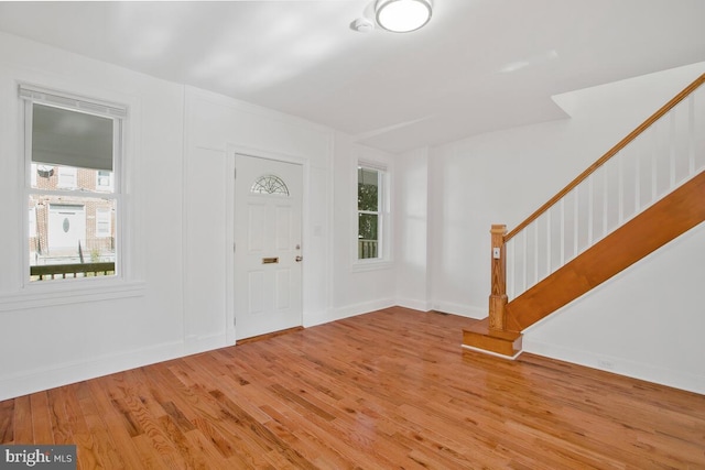 3917 Ridgewood Ave, Baltimore, MD 21215 - foyer featuring stairs, light wood-style flooring, plenty of natural light, and baseboards