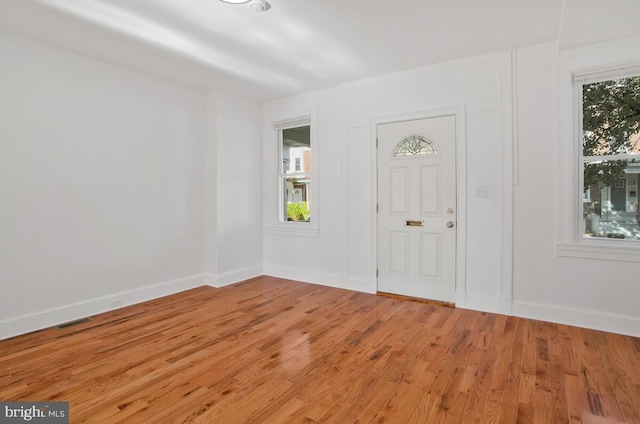 3917 Ridgewood Ave, Baltimore, MD 21215 - foyer entrance with light wood-style flooring and baseboards