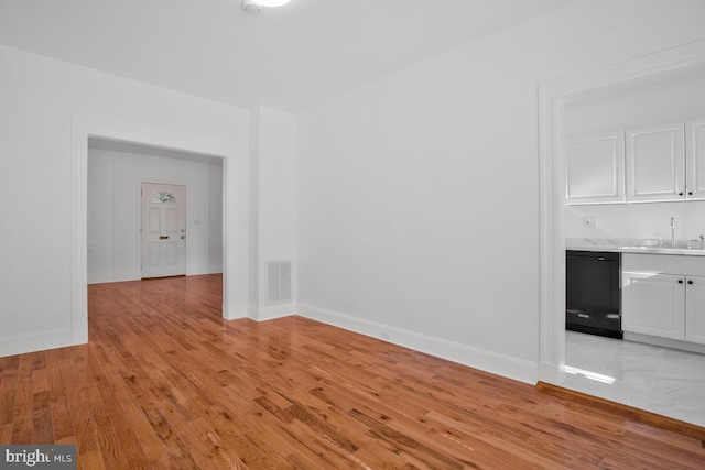 spare room featuring light hardwood / wood-style floors