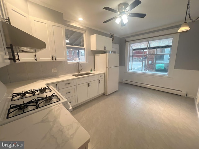 kitchen featuring white appliances, sink, a baseboard radiator, white cabinetry, and extractor fan