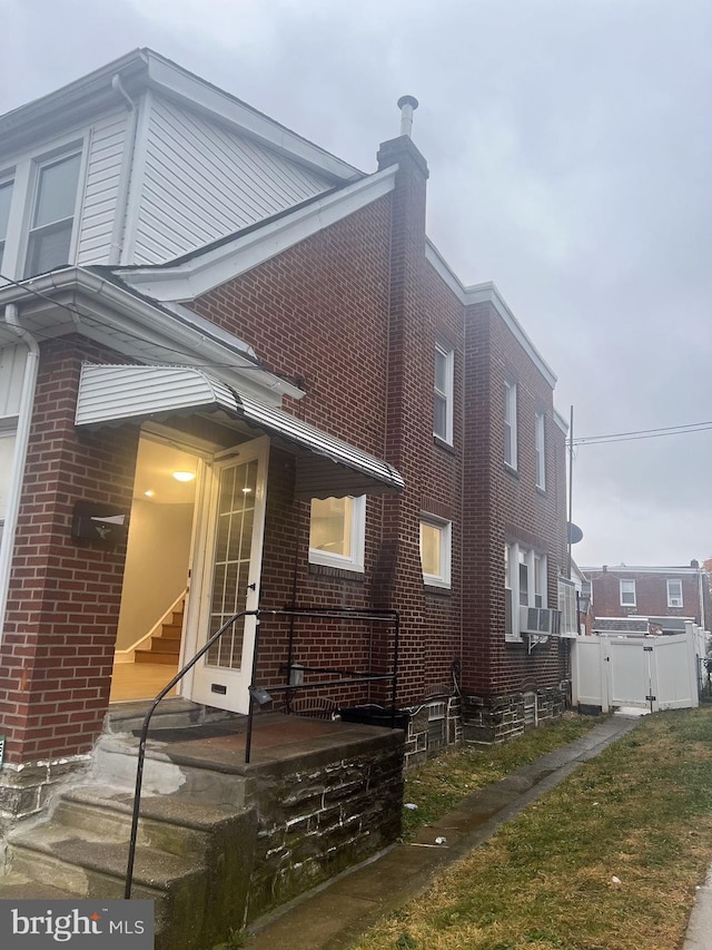 view of side of home with cooling unit