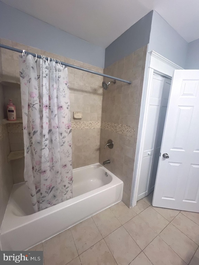 bathroom with tile patterned flooring and shower / tub combo