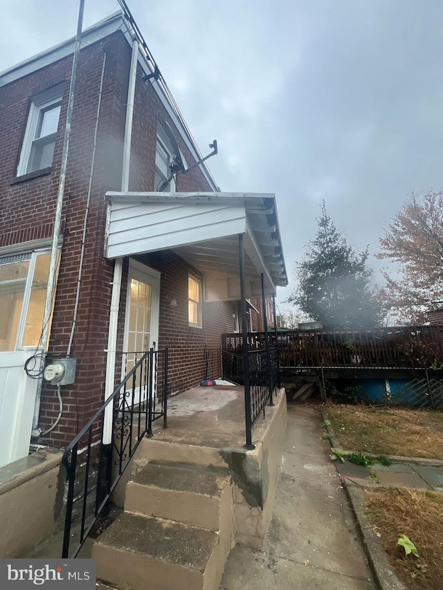 view of side of home with a porch