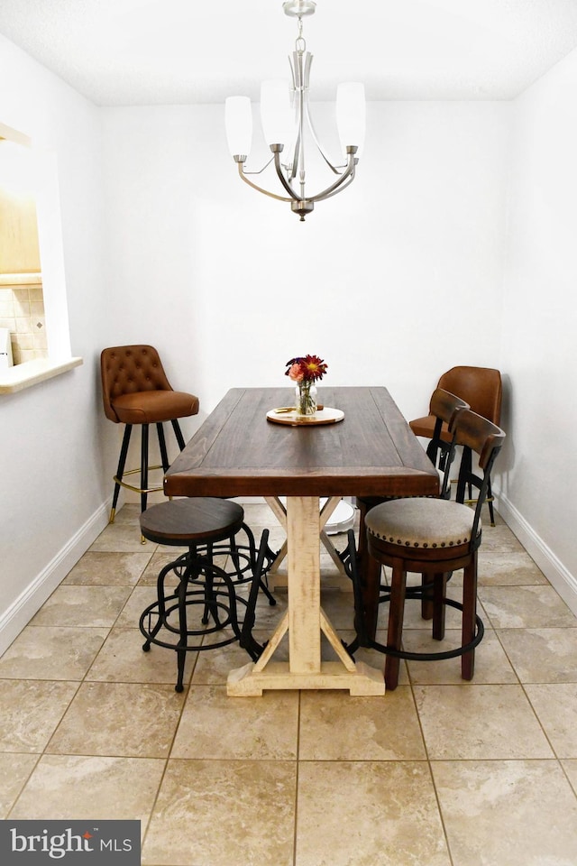 dining space featuring an inviting chandelier