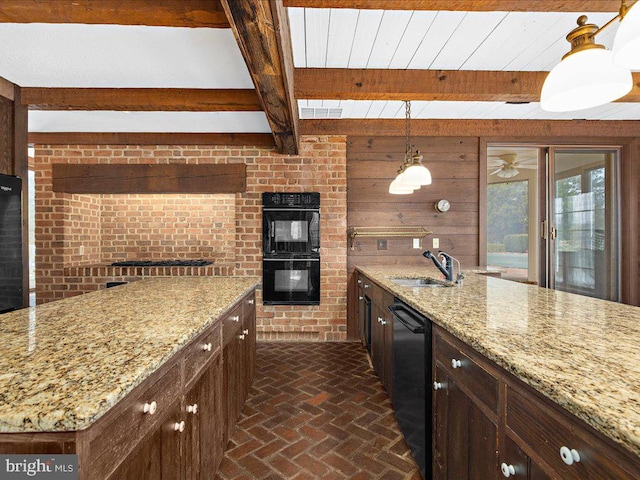 kitchen with light stone countertops, sink, hanging light fixtures, beamed ceiling, and black appliances