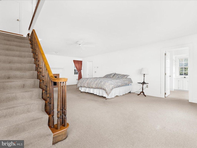 carpeted bedroom featuring ceiling fan