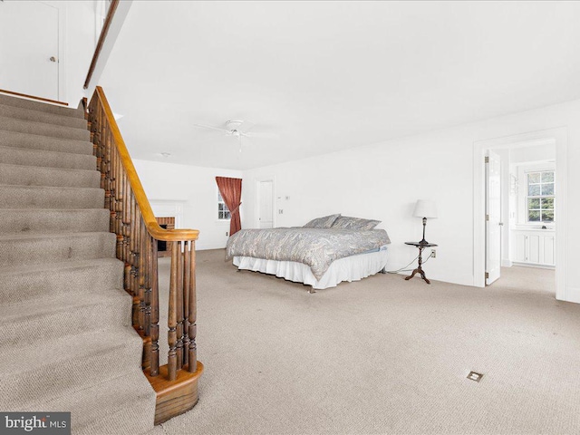 carpeted bedroom with ceiling fan