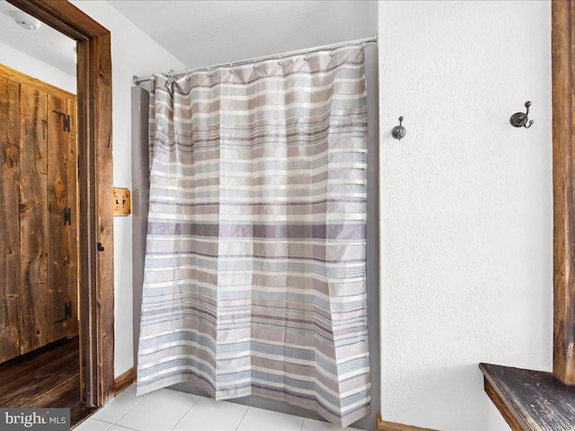 bathroom featuring tile patterned flooring