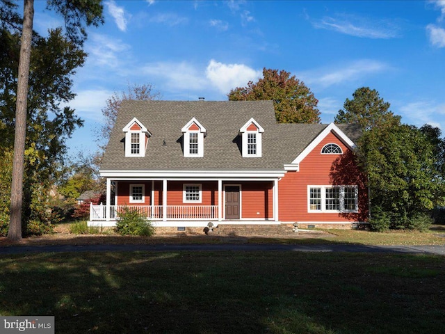 cape cod-style house with a porch and a front yard