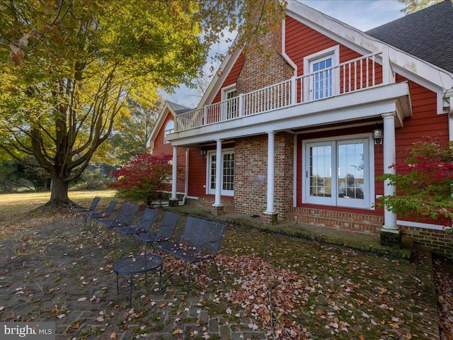 exterior space featuring a balcony