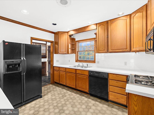 kitchen with decorative backsplash, sink, black appliances, and ornamental molding