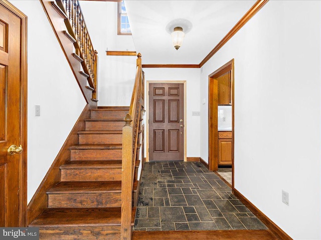 foyer featuring crown molding